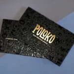 Premium Spot UV business cards in Dubai showing glossy logo coating on matte finish